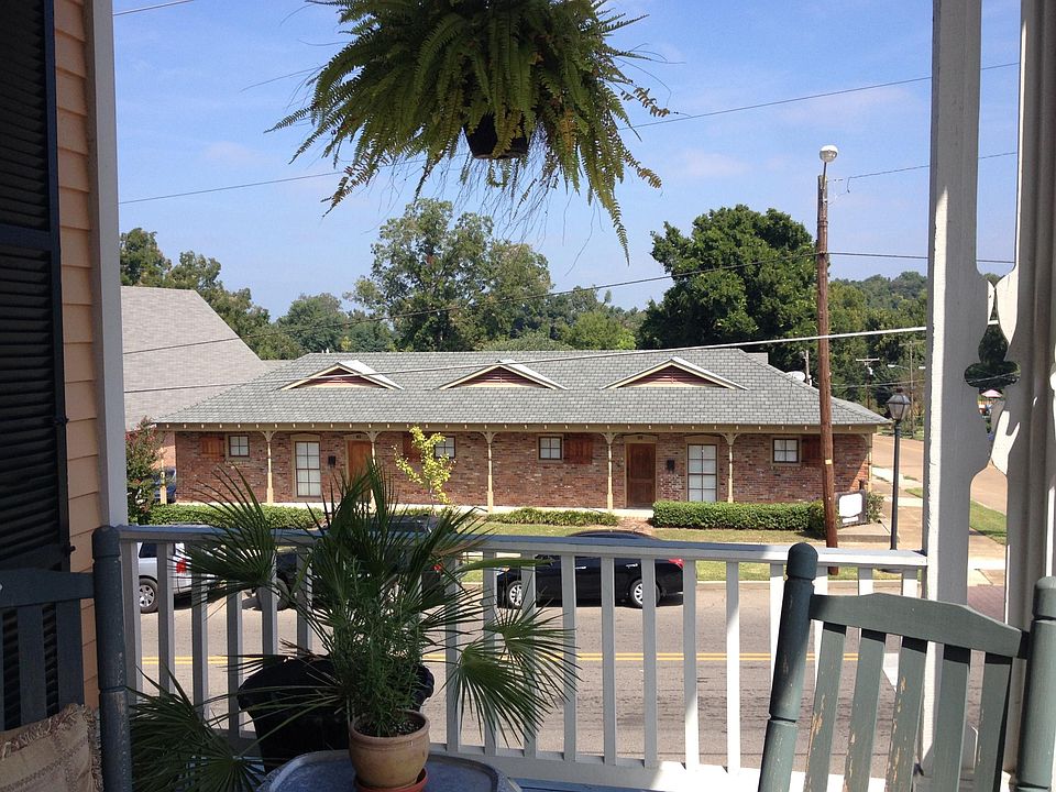 The Coachman's Quarter front that faces First East Street as seen from my porch across the street. Off street parking is located behind the building off of Cherry Street. Easy access from your parked vehicle to the Coachman's Quarters rear entry.