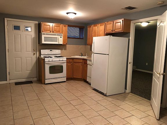 Kitchen and main room combo (door to bedroom)