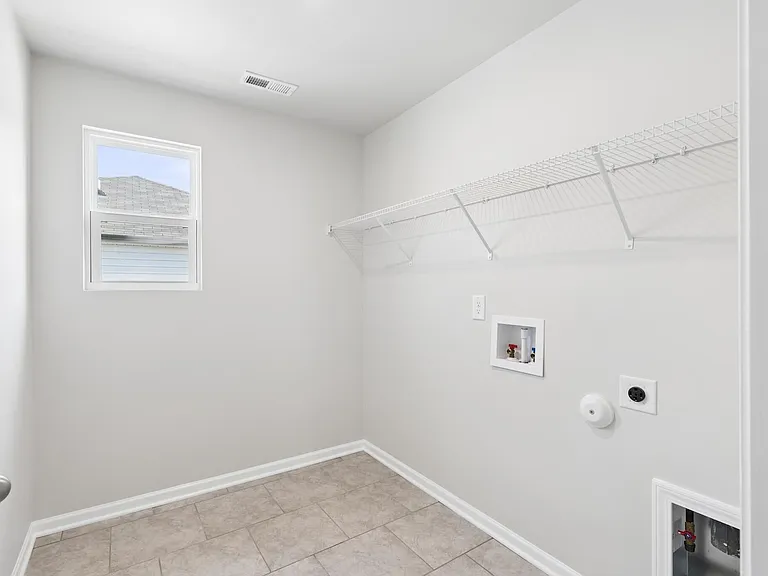 Laundry room with washer dryer hookups ready to go