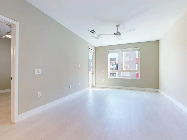Apartment Living Room with Wood-Style Flooring and Patio/Balcony.