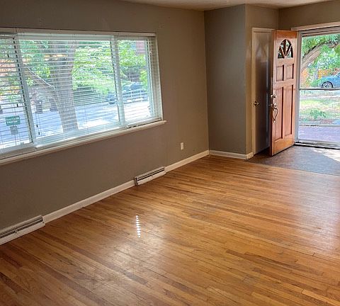 Front living room with lots of windows towards the front yard.