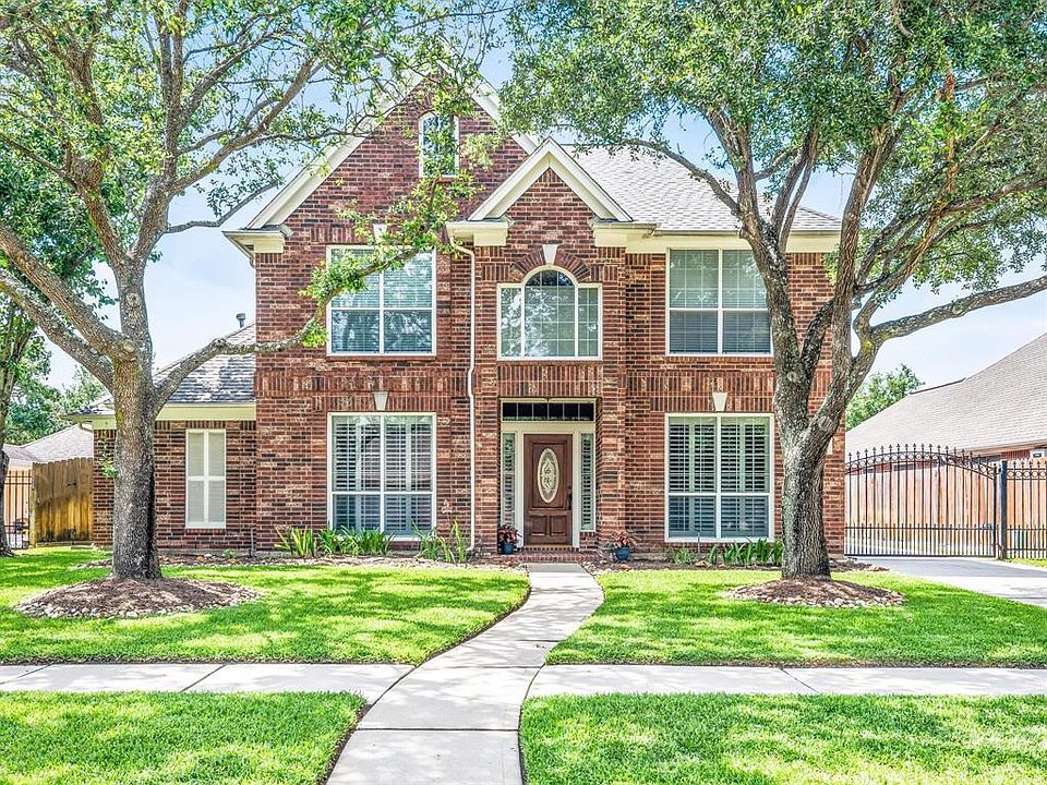 This home has been well-maintained by its original owners that have added numerous upgrades, one of which is an iron driveway gate.
