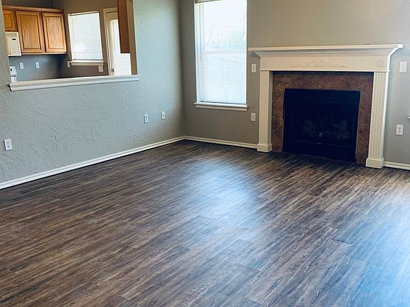 Living room with a view into kitchen