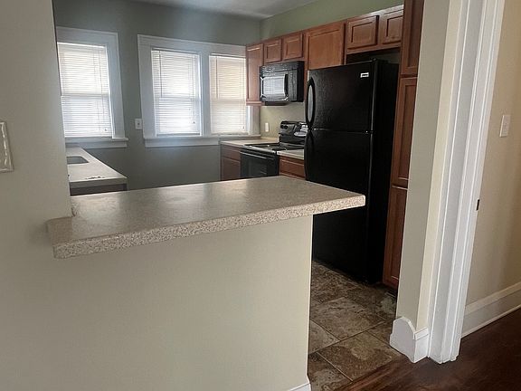 Kitchen view with open concept and bartop seating for 2