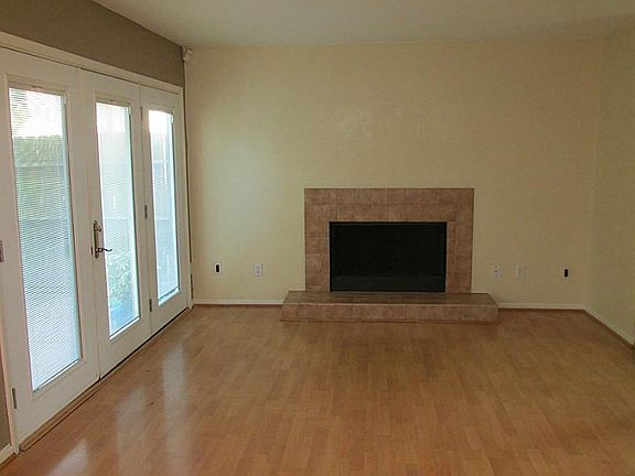 Living area with wood burning fireplace and built in sound.