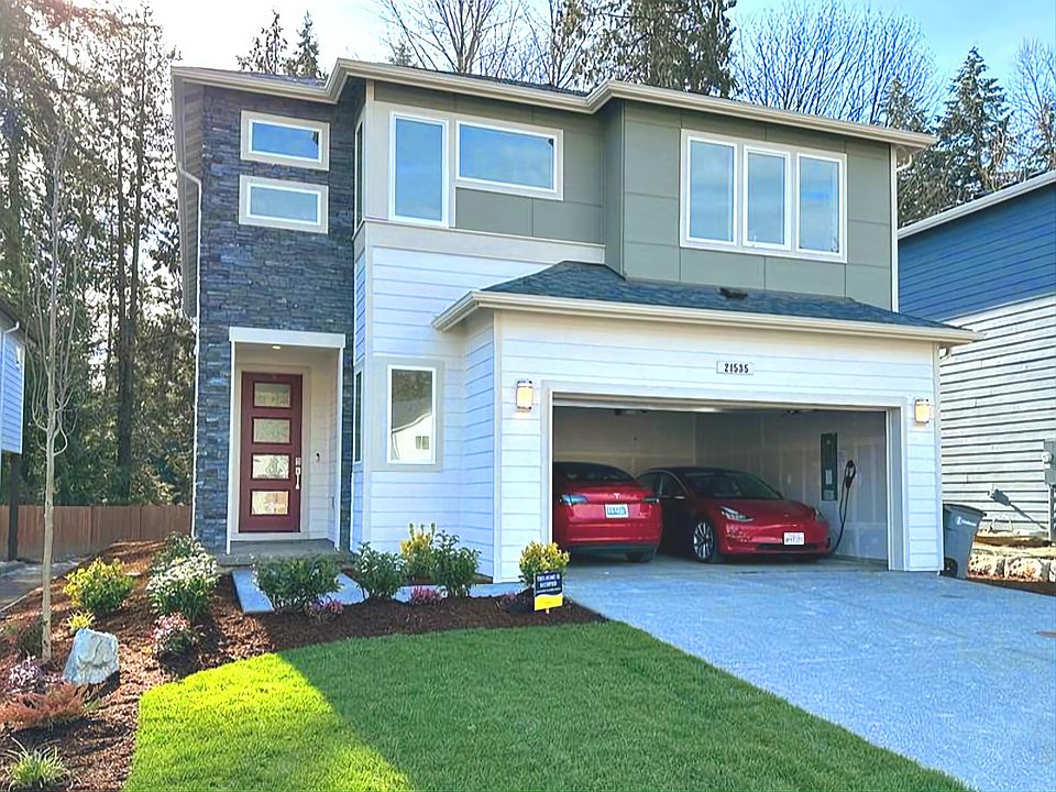 House from outside, with 2 car garage, and front yard
