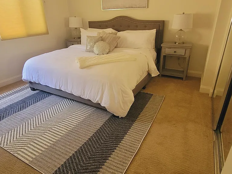 Bedroom 2 - King bed, large closet, desk, large TV, ensuite with shower and bathtub