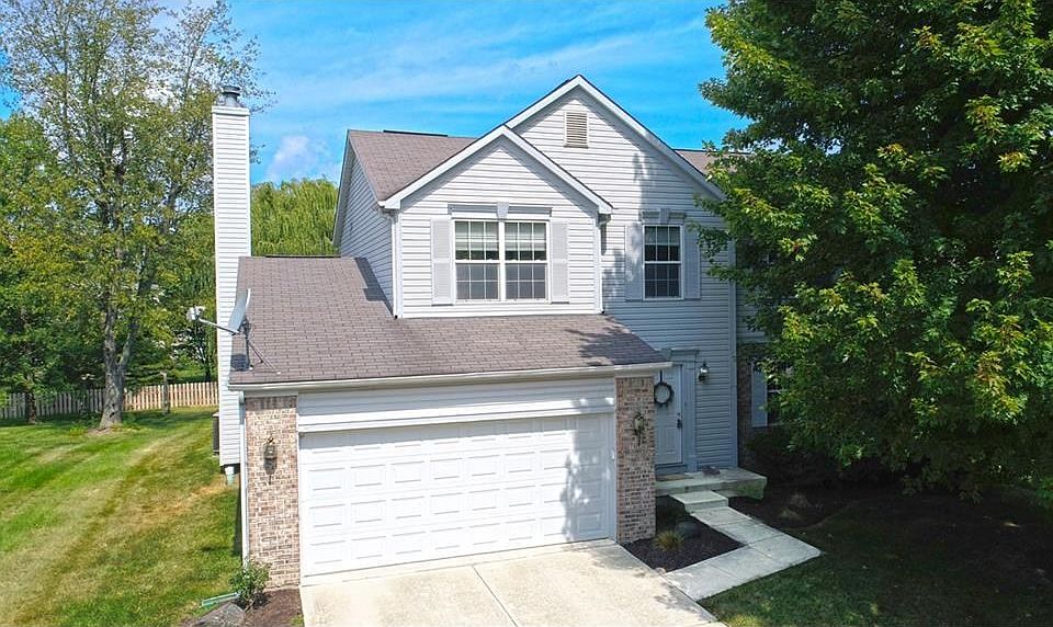 Beautiful exterior with freshly landscaped yard