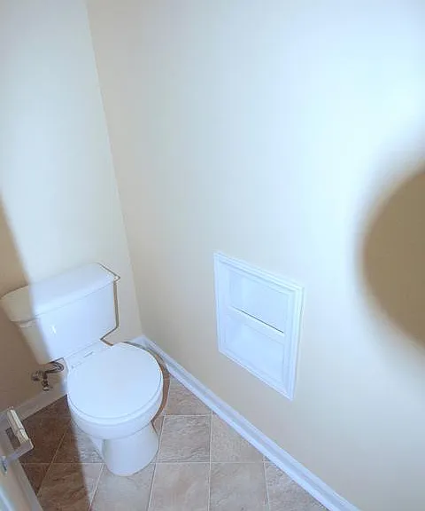 Water closet in Master Bath - We have renovated flooring to LVL planks.
