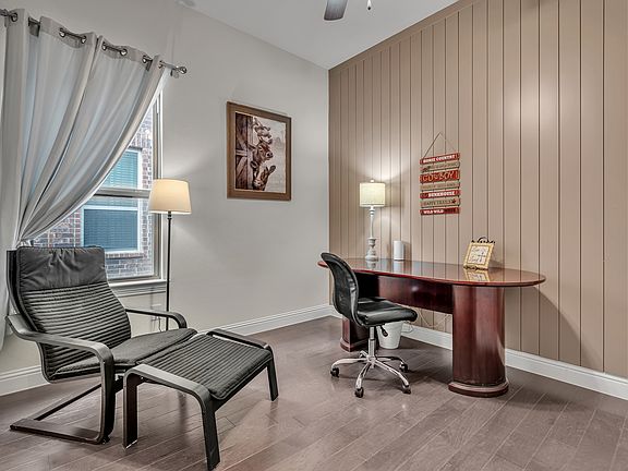 Larger office that can be set up as a 4th bedroom with a twin bed if needed. Closet, ceiling fan, executive desk, chair, and reading chair are currently in this room. A baby bed is available to set up if desired too.