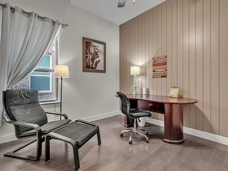 Larger office that can be set up as a 4th bedroom with a twin bed if needed. Closet, ceiling fan, executive desk, chair, and reading chair are currently in this room. A baby bed is available to set up if desired too.