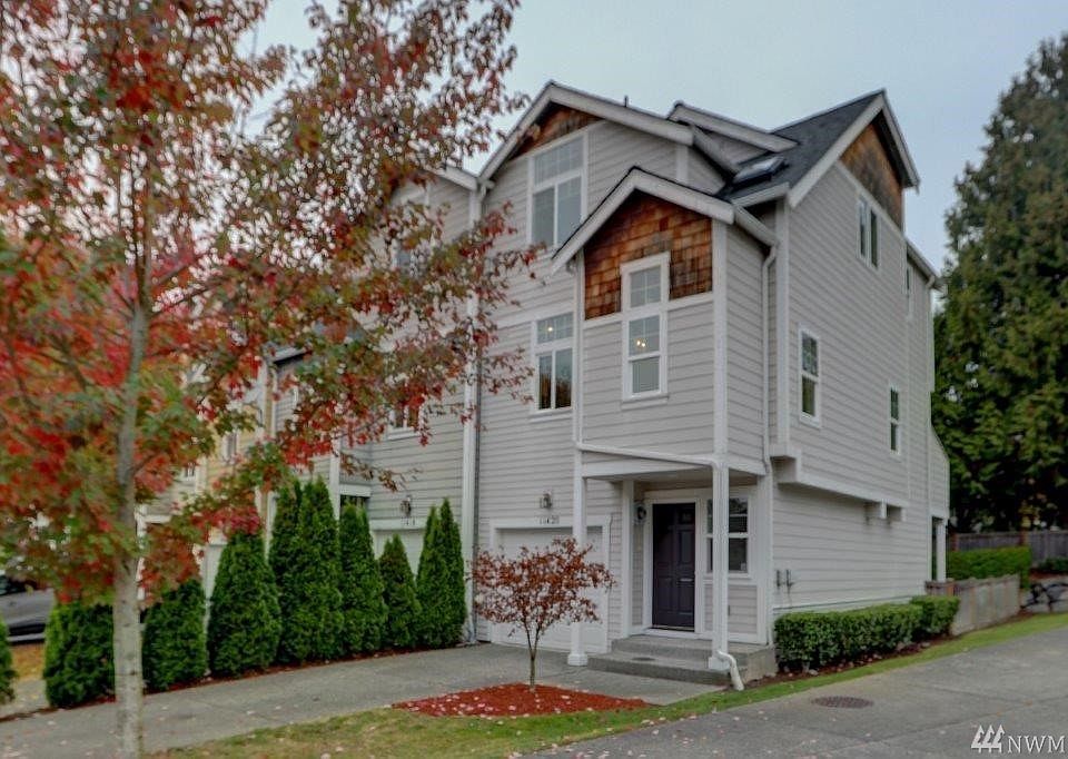 Wow! Corner lot with extra windows, 2 1/2 car tandem garage ( it is the whole lower level of the home) and nice fenced backyard.