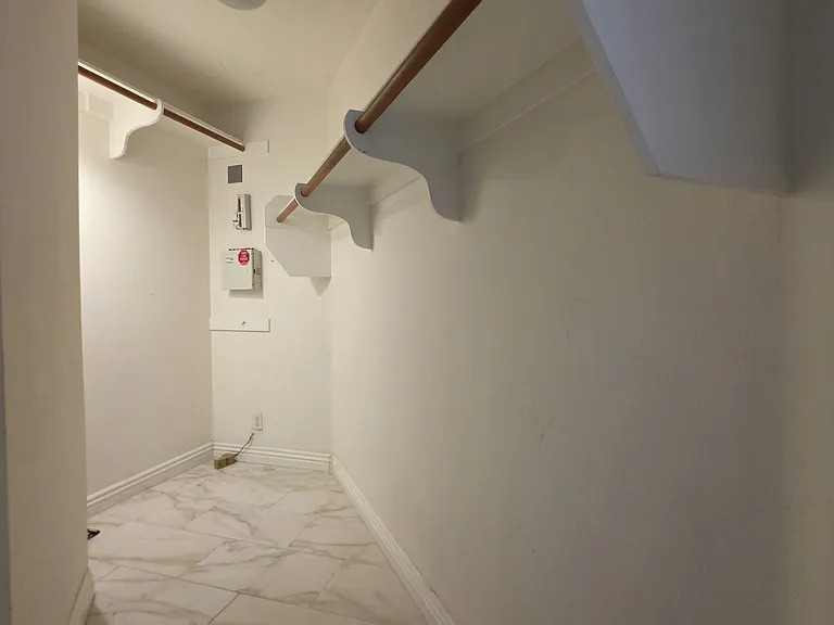 Walk-in closet in primary suite