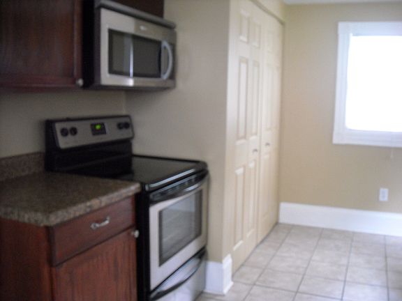 kitchen with built in laundry area with washer and dryer