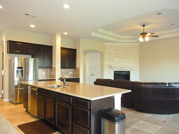 Amazing granite island is over 10' long, Easy counter level seating, Samsung fridge + 5 burner gas c