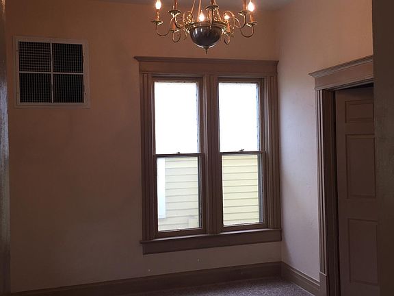 Main floor living area, entrance to bathroom