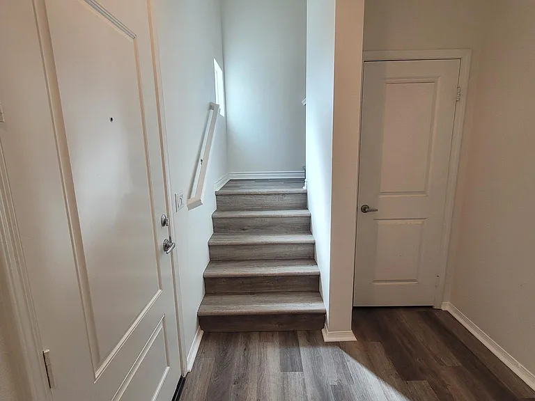 Entry way and foyer featuring new flooring, and ample shoe and coat closet.