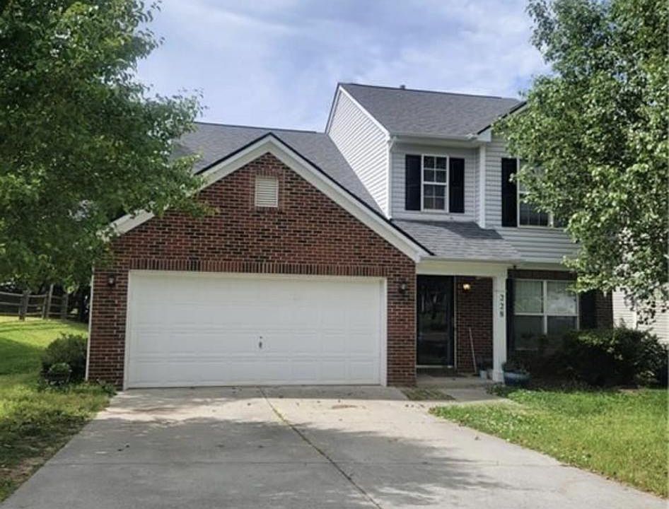 Front of the house with spacious drive way