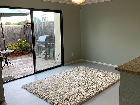 Dining area with new plush area rug.