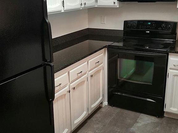 The updated kitchen features beautiful granite counter tops.