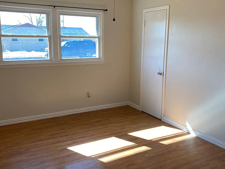Primary bedroom. Features brand new custom paint, walk in closet, and an on suite bathroom.