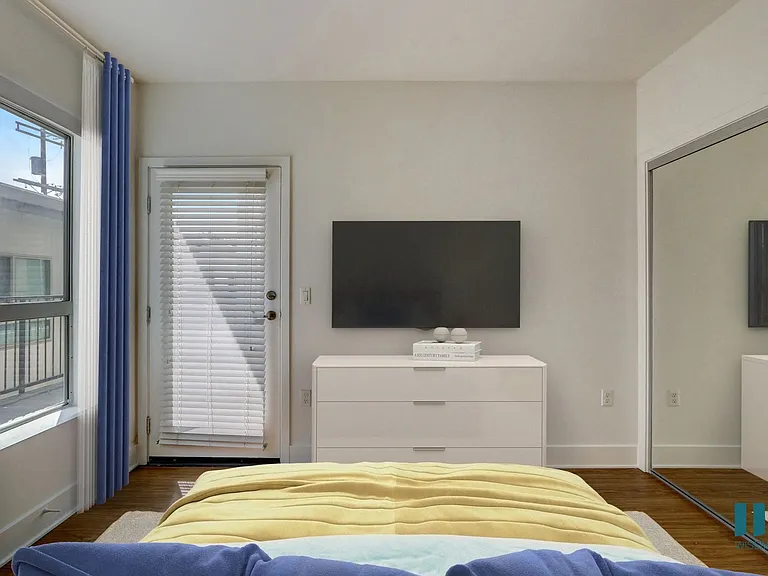 Bedroom with Large-Size Windows, Mirrored Closet, Vinyl Flooring, and Patio