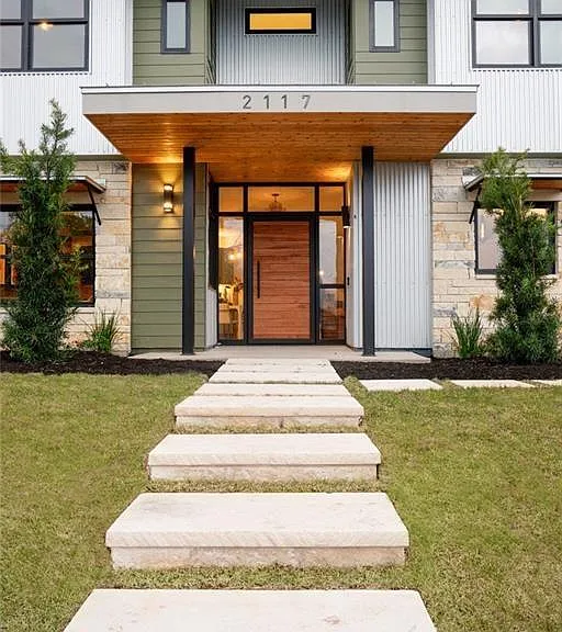 Custom window-wall entryway with a dramatic 45" wide front door!!