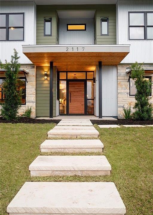 Custom window-wall entryway with a dramatic 45" wide front door!!