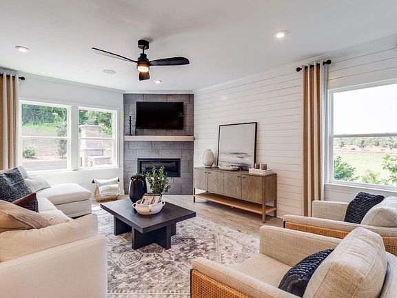 Gathering room with a fireplace to enhance your entertaining space.