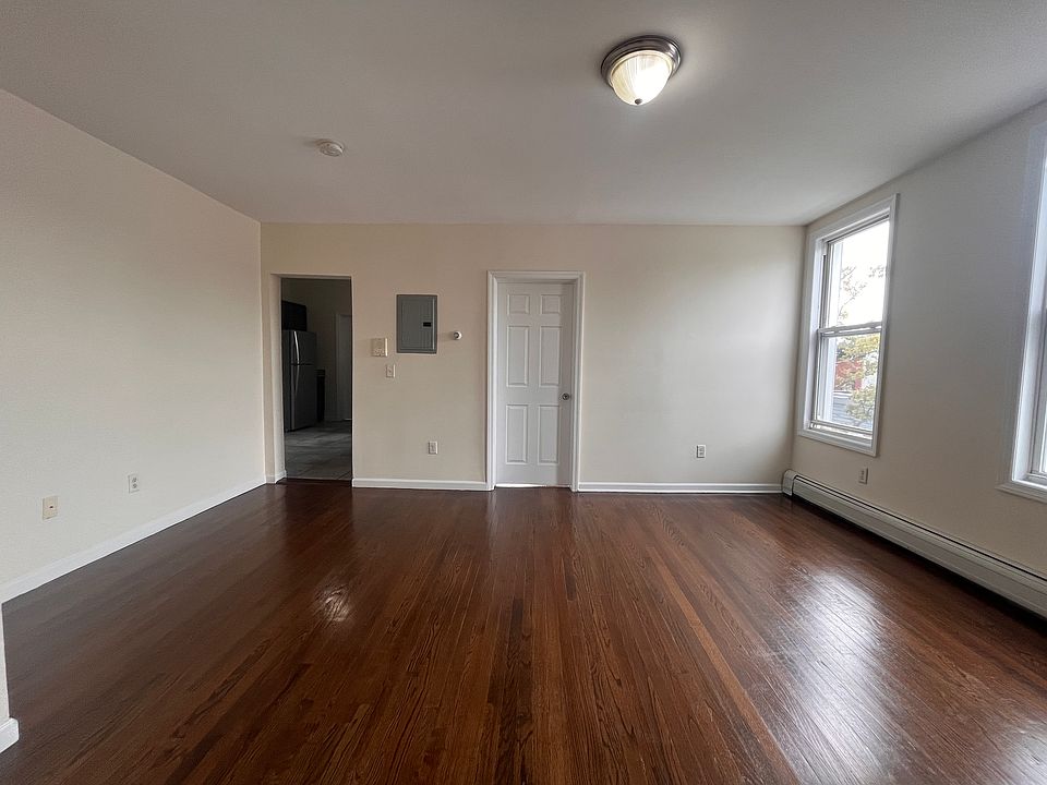 Living room. 
Kitchen entrance to the left. Bedroom 1 to the right (closed door).
