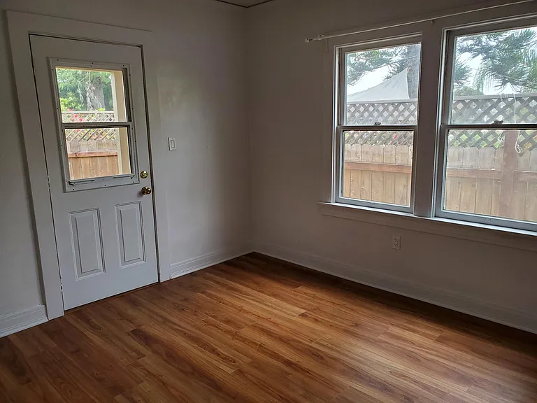 Bedroom 3-has main access to back yard. Excellent for office or sunroom.