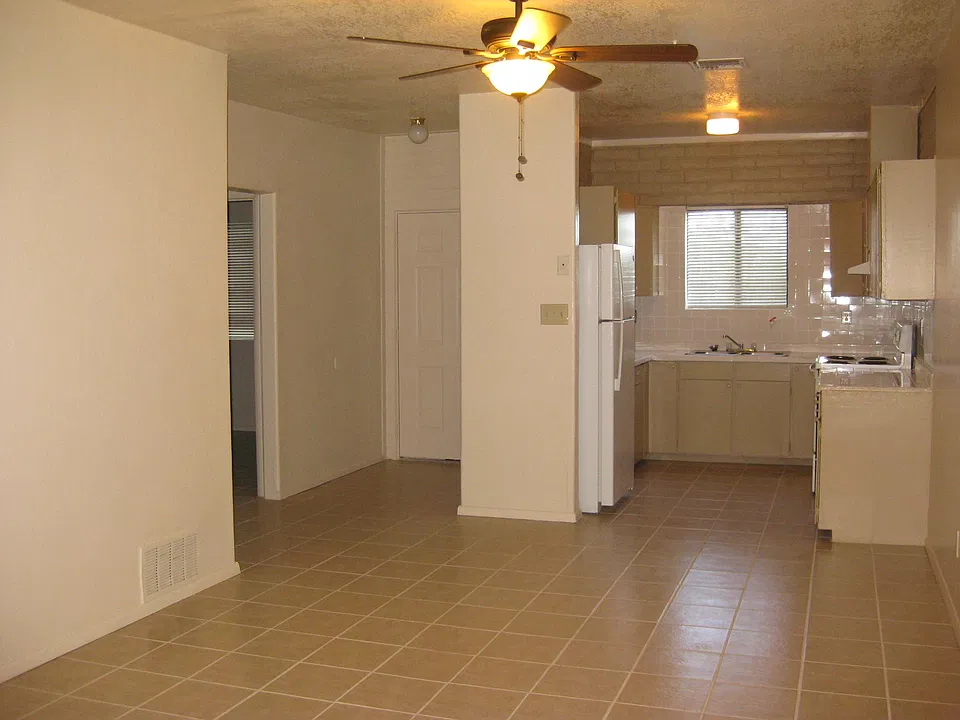 Living room view with kitchen
