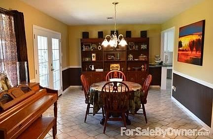 Airy Living Room
						:
						With beautiful floors and an open feel, this living room is cozy and charming.