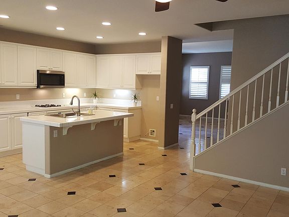 Spacious kitchen with ample cabinets and storage