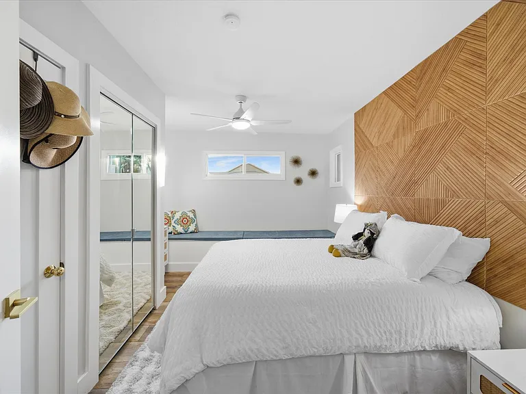 Guest Bedroom with Custom Cabinets and Storage Bench.