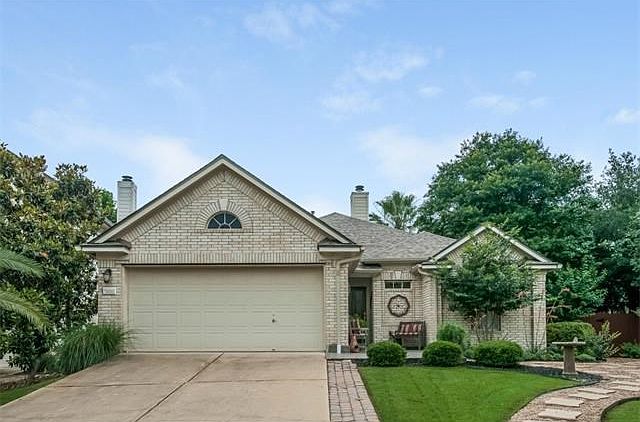 On a secluded cul-de-sac just a block or two from Circle C Park, the home is distinguished by its handsome white brick and professional landscaping.