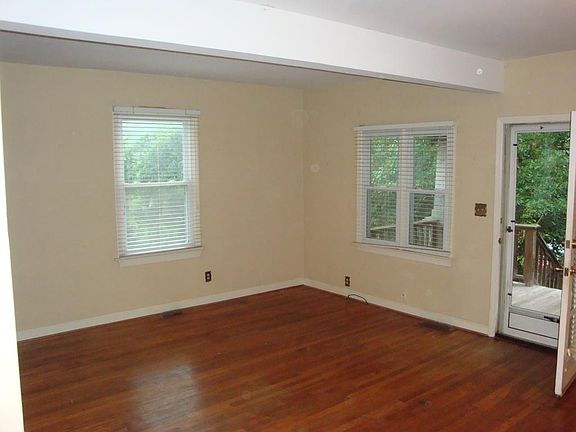 view of front door from fireplace and hallway