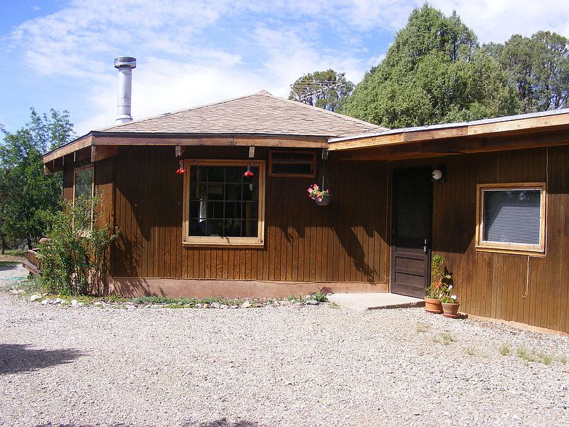 Front Entry : Front door with screen, gravel circular driveway, hummingbirds love it here.