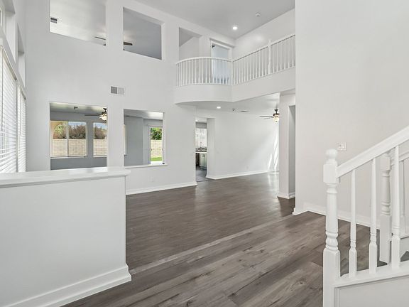 Entry looking to living room and formal dining room