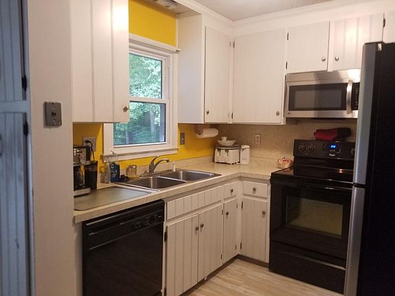Kitchen - Newer stove, microwave, dishwasher
