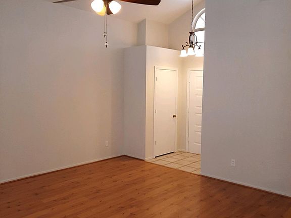 Spacious family room with plenty of windows for natural lighting and vaulted ceilings for dramatic distinction. Freshly painted interior with pleasing colors is another plus.