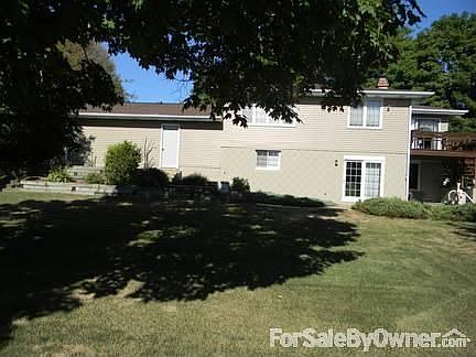View of backyard and back of house : Large backyard, pool to right side from this view.