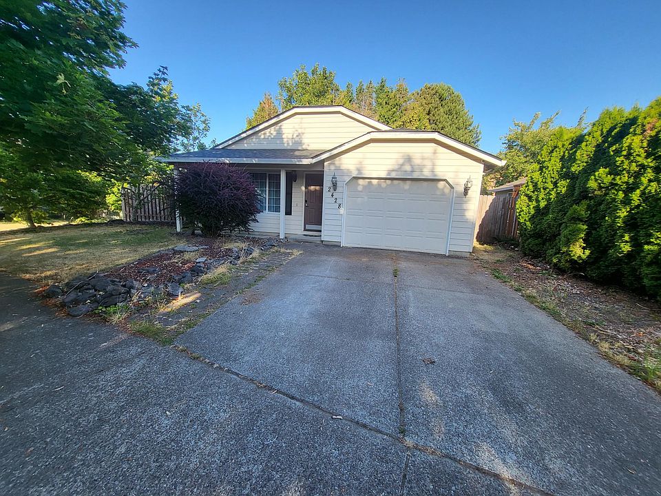 Front of the house has a large driveway, big enough for two vehicles.