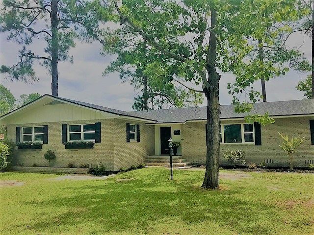 Brick home w/limewash paint
