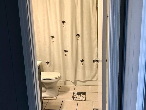 Upstairs bath has ceramic tile.