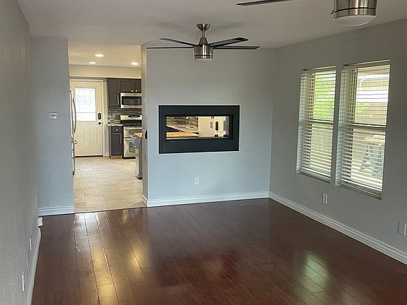 View into living room and kitchen from front door.