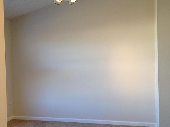 master bedroom with vaulted ceiling