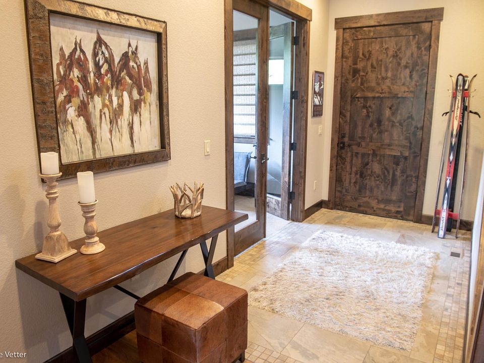 Entryway. Looking back at the front door. Office is thru the French doors on the left.