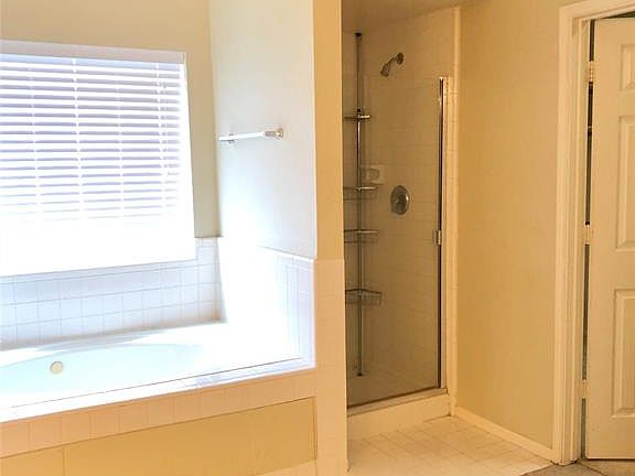 Large tub & separate shower and linen closet