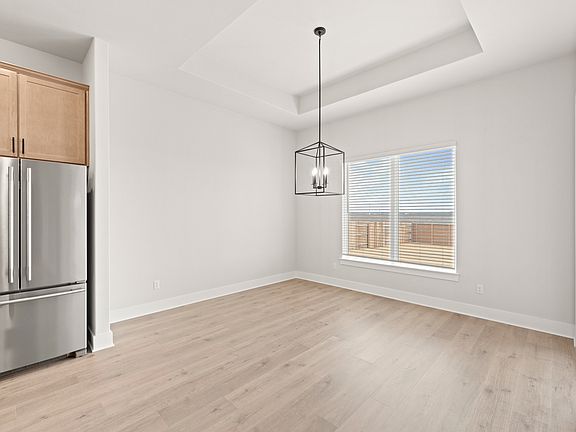 The dining room sits right off of the kitchen.